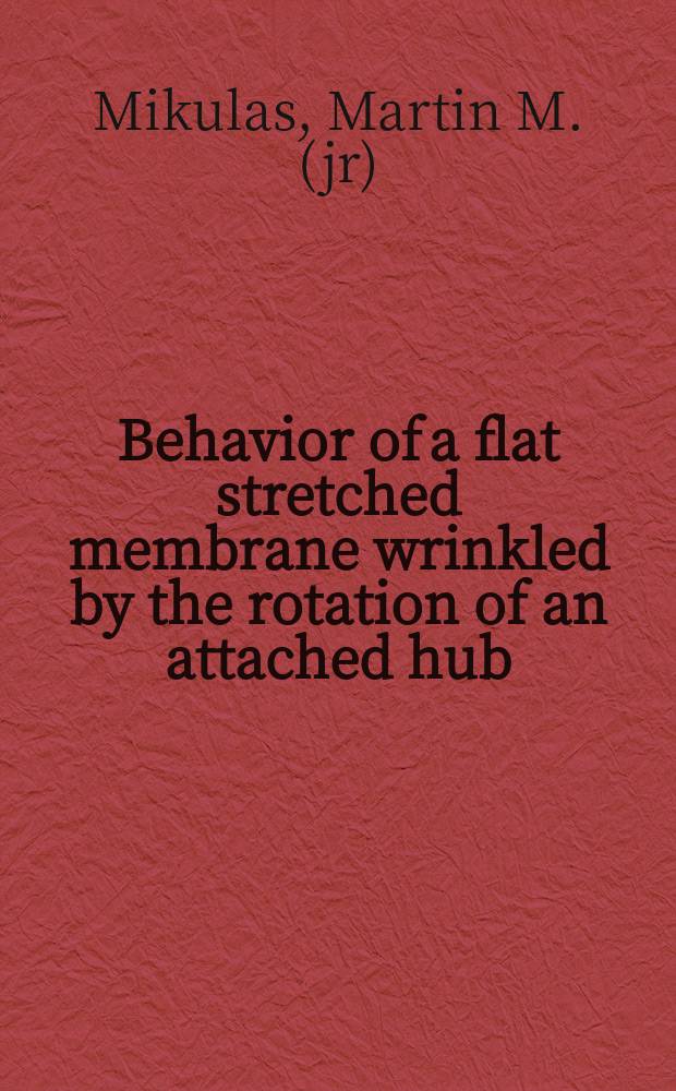 Behavior of a flat stretched membrane wrinkled by the rotation of an attached hub